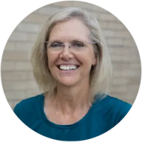 Image of instructor Karen facing front,blonde hair, wearing glasses and a blue shirt.