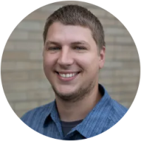 Image of instructor Kyler facing front, blonde hair, strip printed shirt.